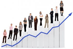 group of business people with a chart representing growth and success - isolated over a white background